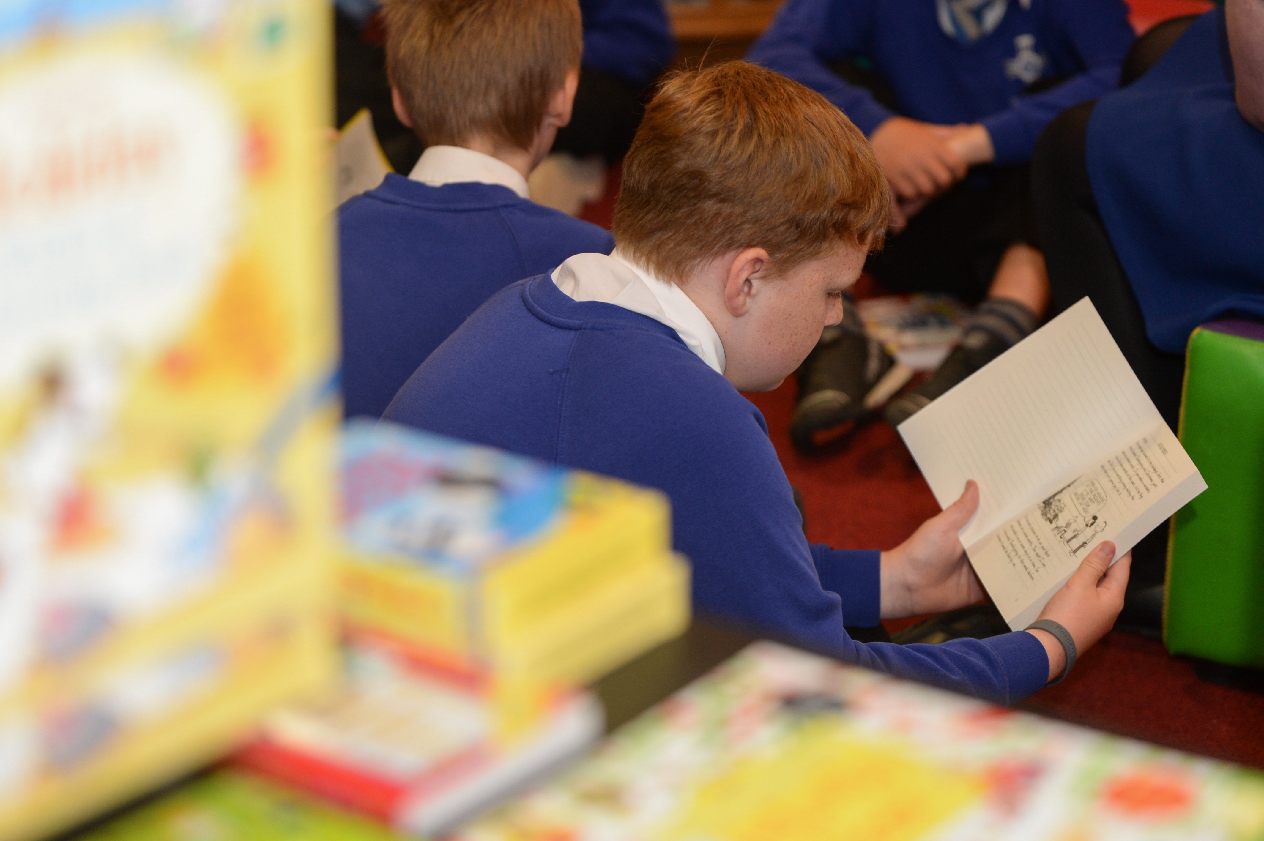 Boy reading classroom