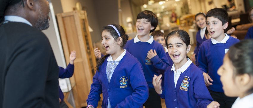 School children in uniform looking excited