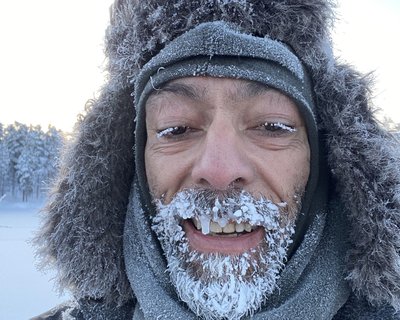 Man with icicles on his beard Arctic Challenge