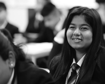 Busy classroom secondary girl greyscale National Literacy Trust