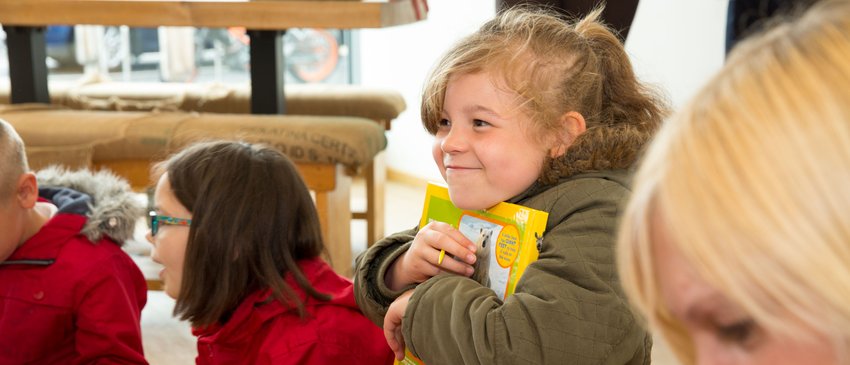 Child holding a book.JPG