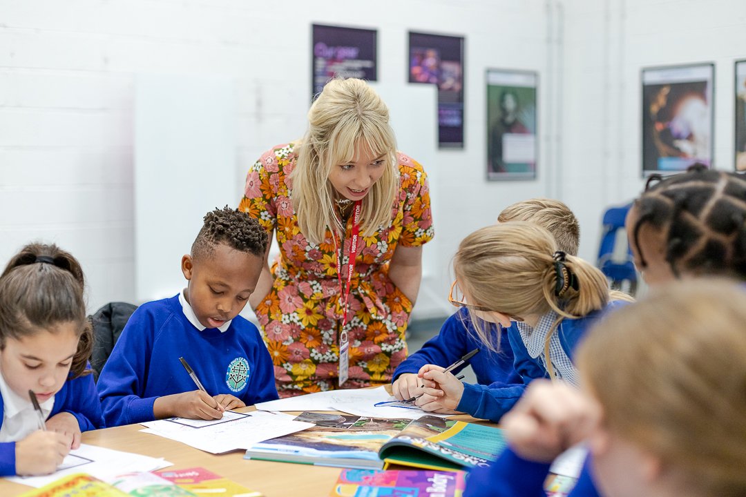 Children chatting with Emily Coxhead during National Literacy trust in Salford launch event