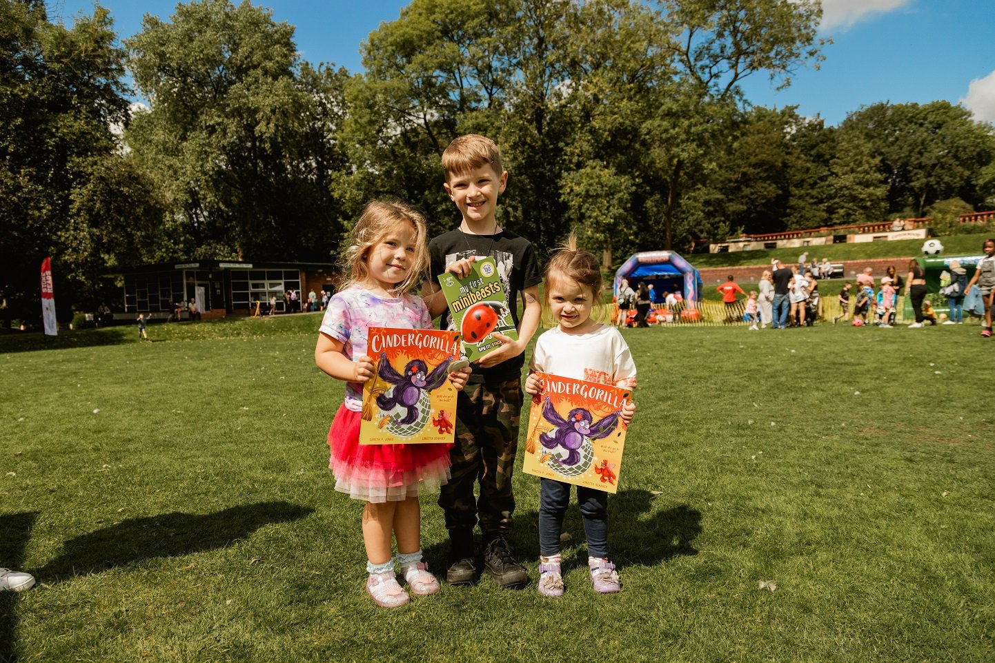 Children enjoying free books at Tales in the Park