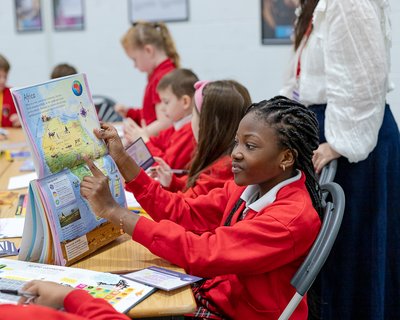 Children searching for facts during Emily Coxhead Workshop