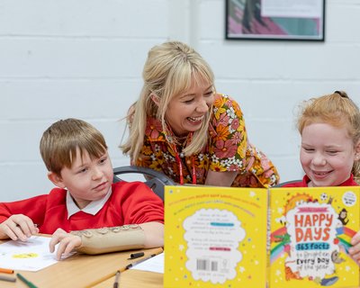 Children taking part in workshop with Emily Coxhead