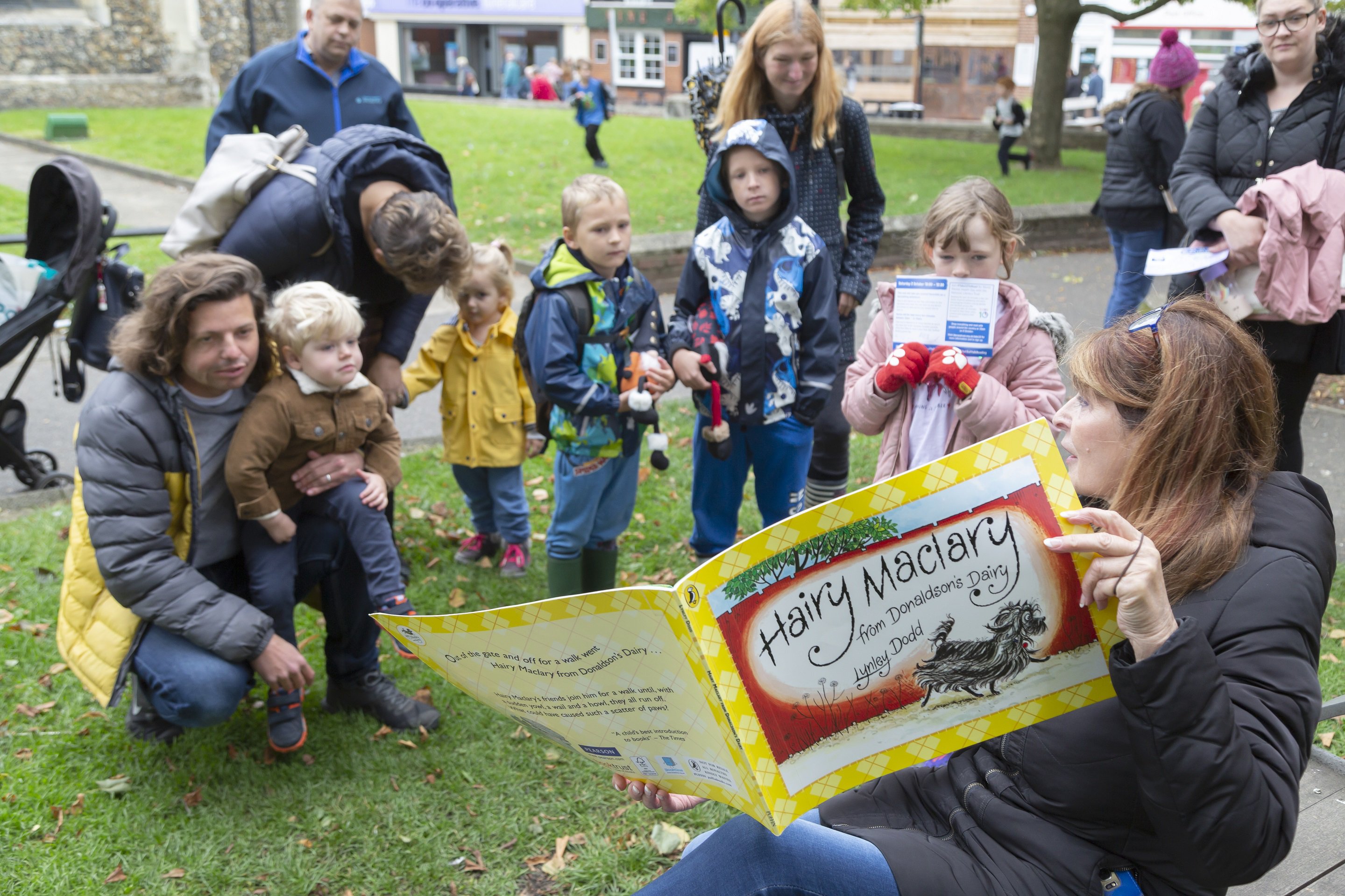 Councillor Margaret Marks reads Hairy Maclary from the Tim Marks memorial bench low res.jpg