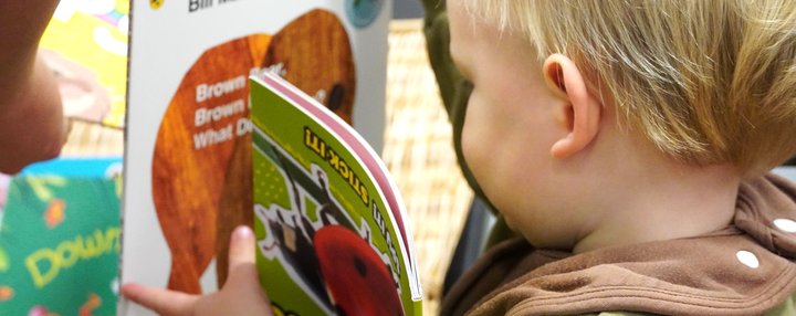 boy book turned away from camera