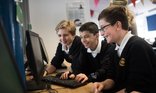 Secondary boys on computer