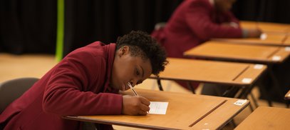 Secondary pupil taking exam