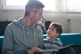 Dad and son sharing a book.jpg