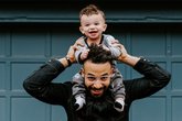 Early Words Matter Dad with baby smiling on his shoulders