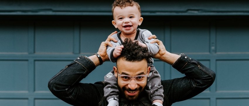 Early Words Matter Dad with baby smiling on his shoulders