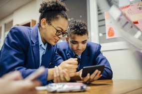 Secondary students with tablet for technology survey