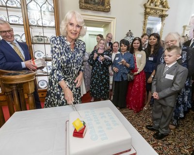 Her Majesty The Queen cuts a special 30th birthday cake at Clarence House reception