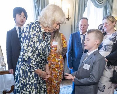 Jayden (pictured right) meeting Her Majesty The Queen