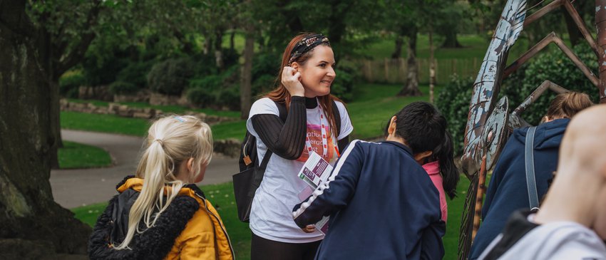 National Literacy Trust staff leading families on a Story Quest in Burslem Park at launch event