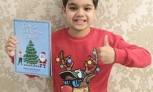 Milan Kumar with Covid Christmas Parade book Dec 2020.jpg