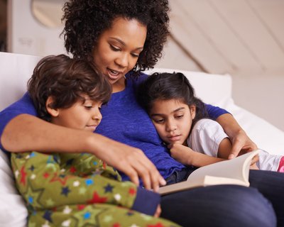 Mum reading with son and daughter.jpg