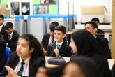 Secondary school classroom - pupils laughing while sat at desks