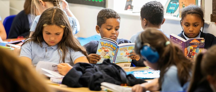 Children read books in school. Drake Circus - Young Readers Programme