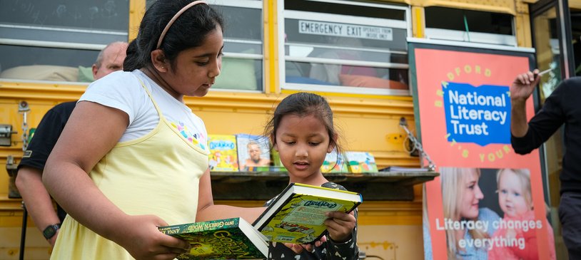 Bradford School Bus community event - children looking at books