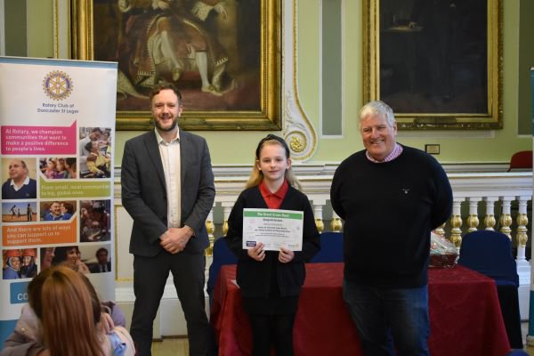 Selena S, Doncaster&#x27;s Great Green Read Winner 2022, with Doncaster Stories Hub Manager, Phil Sheppard, and Rotary Environmental Lead, Phillip Wilbourn