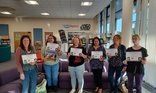 Swindon Stories LC's at storytime training holding certificates.jpg