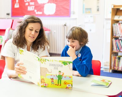 Teacher reading with child.jpg