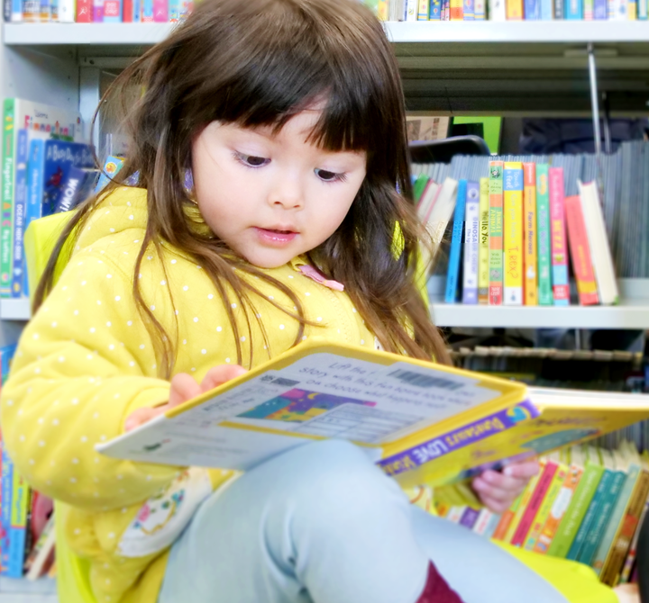 Nottingham child with book in library