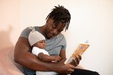 dad and baby read book