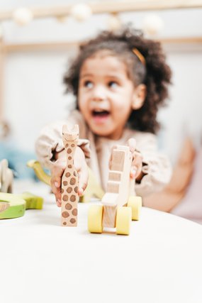 girls with wooden toys.jpg