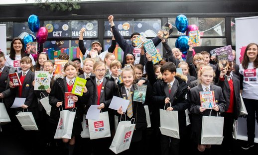 Children from Ark Little Ridge Primary Academy receive free books to take home