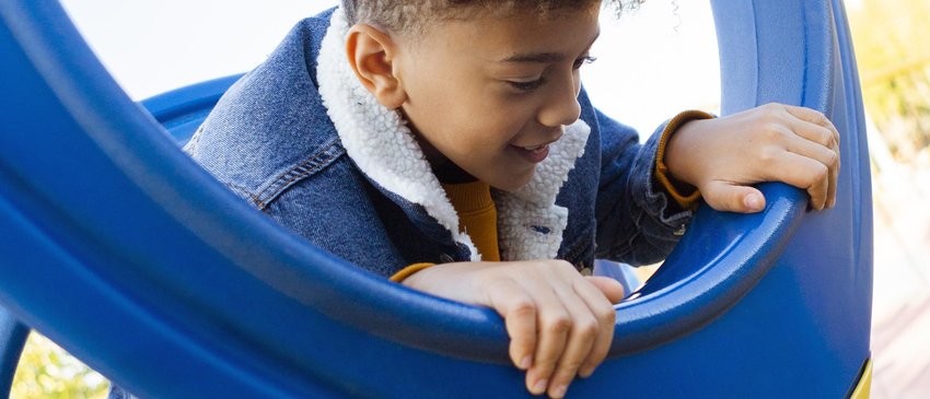 little-boy-having-fun-playground