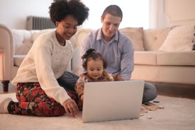parents and child at laptop.jpg