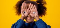 Child with googly eyes on hands_comic relief_pexels