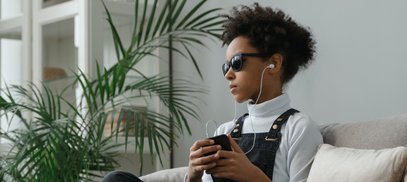 Teen listening with headphones