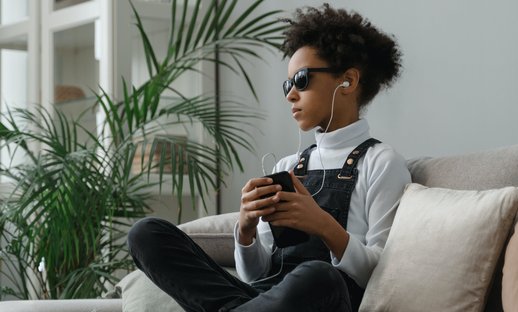 Teen listening with headphones