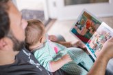 Dad reads picture book with baby_ free Unsplash downloaded photo
