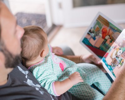Dad reads picture book with baby_ free Unsplash downloaded photo
