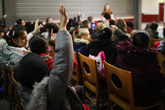 Young Readers Programme child raising hand