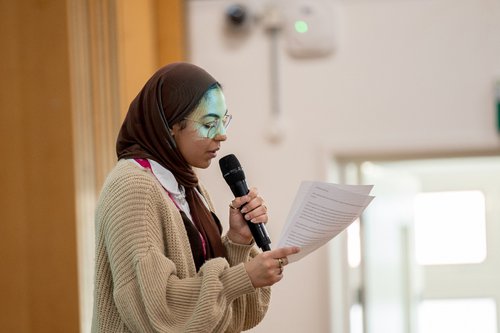 Student making speech at Women in Leadership panel event